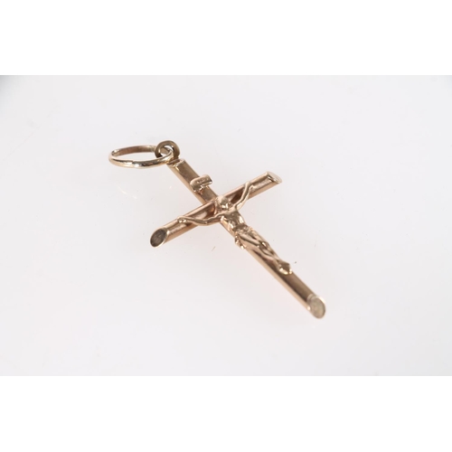 521 - Unmarked yellow metal crucifix pendant, 2.8g.