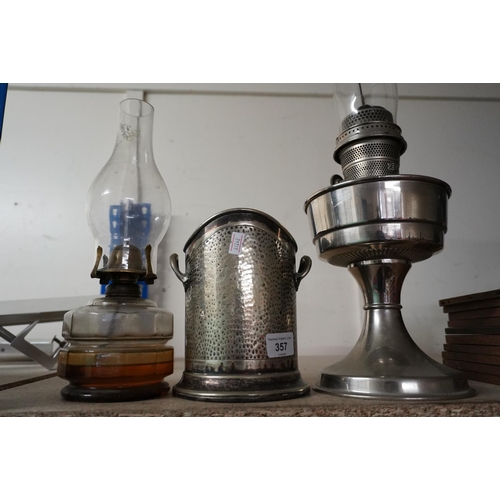 357 - Paraffin lamp, an oil lamp and a silver-plated wine bottle holder.