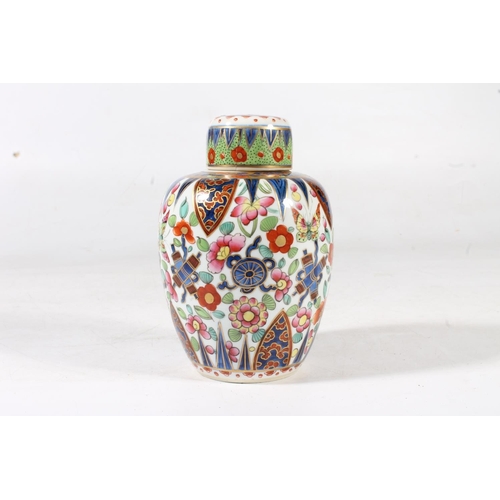 244 - Oriental porcelain ginger jar decorated in polychrome with auspicious symbols, 15cm high.