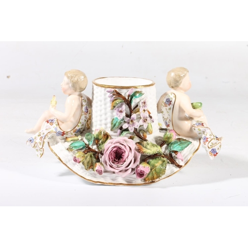 250 - Continental porcelain spill vase applied with two putti.