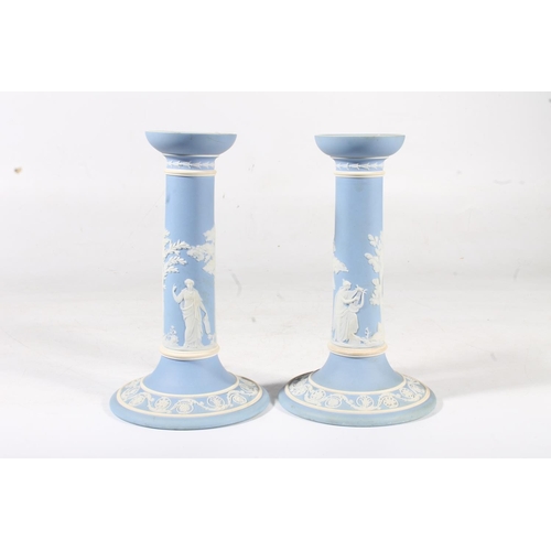 258 - Pair of early 20th century Wedgwood pale blue jasperware candlesticks, 20cm high.