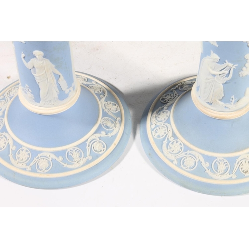 258 - Pair of early 20th century Wedgwood pale blue jasperware candlesticks, 20cm high.