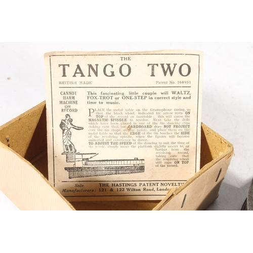 268 - Vintage Tango Two cardboard and tin novelty dancing couple for a gramophone.