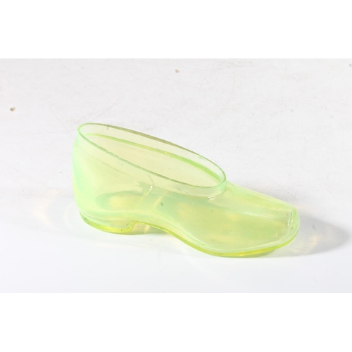 274 - Victorian vaseline glass spill vase in the form of a shoe, 13cm high.