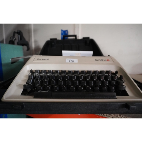 370 - Olympia cased typewriter.