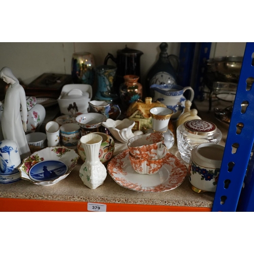 379 - Decorative ceramics to include coloured vases, figures, a Belleek vase, etc.