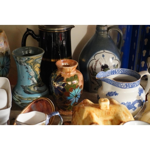 379 - Decorative ceramics to include coloured vases, figures, a Belleek vase, etc.