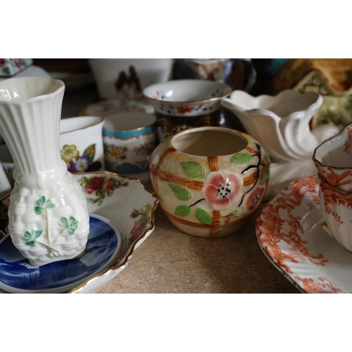 379 - Decorative ceramics to include coloured vases, figures, a Belleek vase, etc.