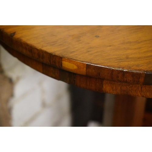 557 - Victorian rosewood occasional table, 73cm high.