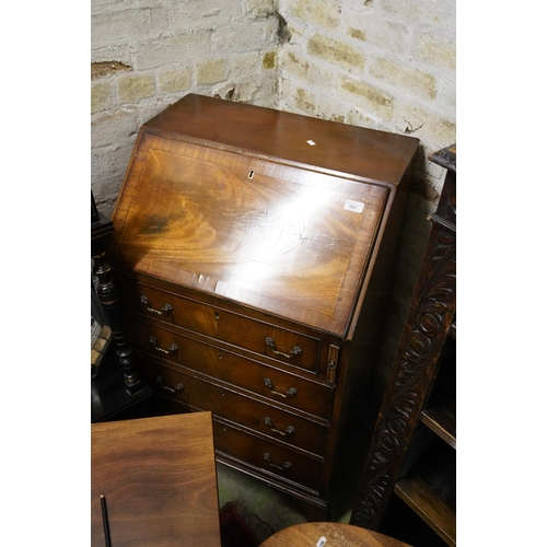 567 - Walnut bureau with fitted interior, 61cm wide.