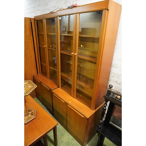 575 - Pair of teak cabinet bookcases, 183cm high, 79cm wide, 43cm.