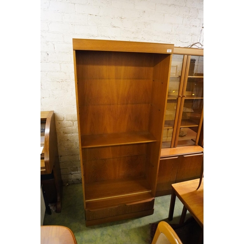 576 - Pair of teak open bookcases with base drawers, 180cm high.