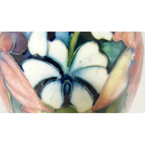 307 - William Moorcroft 'Anemone' pattern tube-lined vase in two-tone green and blue ground, marked to the... 