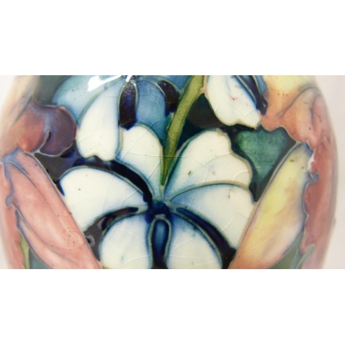 307 - William Moorcroft 'Anemone' pattern tube-lined vase in two-tone green and blue ground, marked to the... 