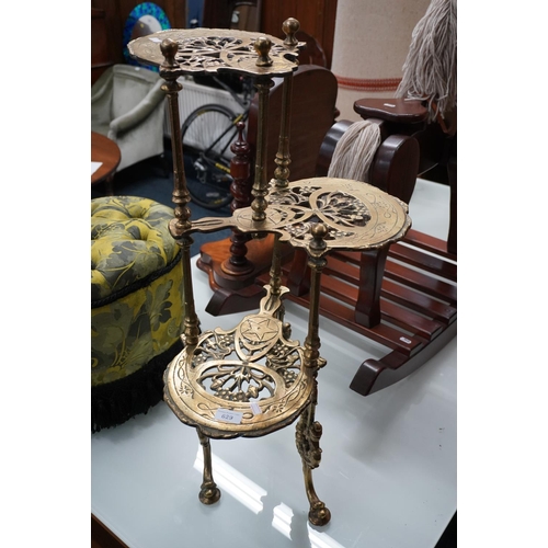 629 - Cast iron three tier pot stand, 78cm high.