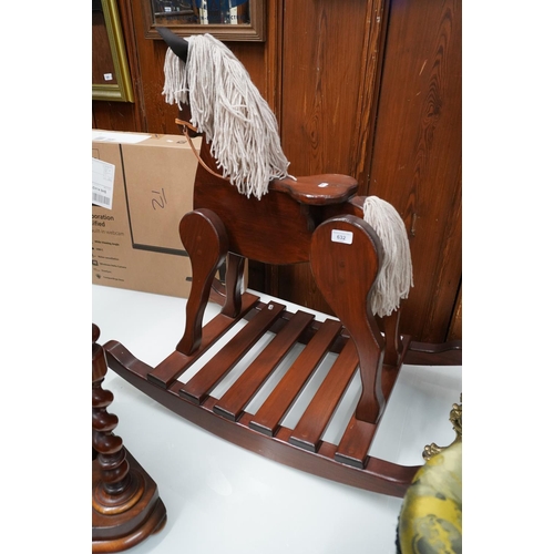 632 - Stained pine rocking horse, 80cm high.