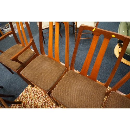 669 - Four Nathan design dining chairs and two matching carvers.