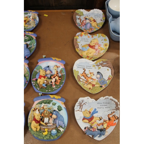 163 - Bradford Exchange Winnie-the-Pooh wall plates and a Winnie-the-Pooh textile wall hanging.