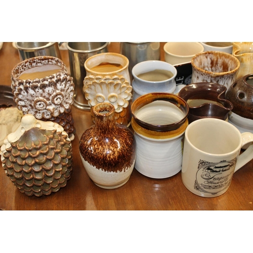 168 - Traquair Pottery to include a hedgehog model, plates, owl beakers, etc.