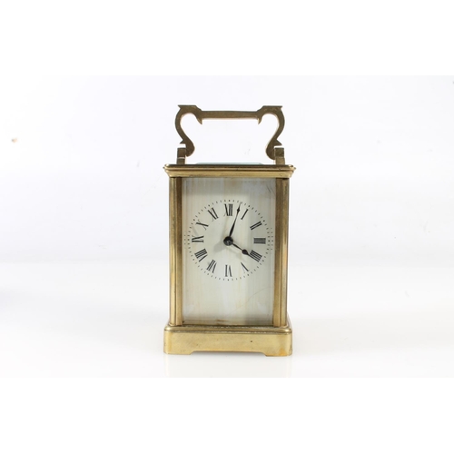 303 - Early 20thC brass carriage clock in burgundy case.