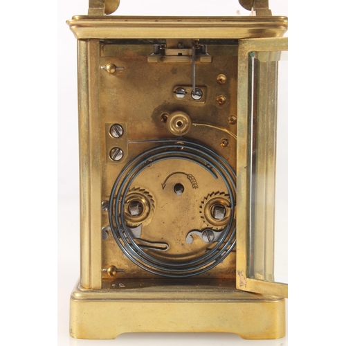 303 - Early 20thC brass carriage clock in burgundy case.