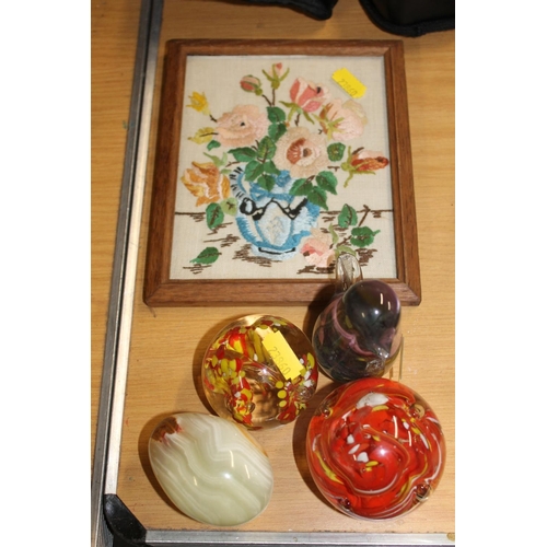 394 - Glass paperweights, a small embroidery, etc.