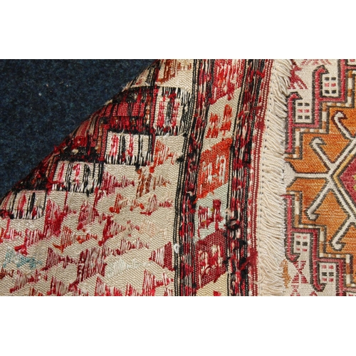 617 - Cream ground kilim rug, central field decorated with three rows of three of various sizes and design... 