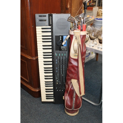 650 - Casio HT-3000 keyboard and a set of golf clubs.