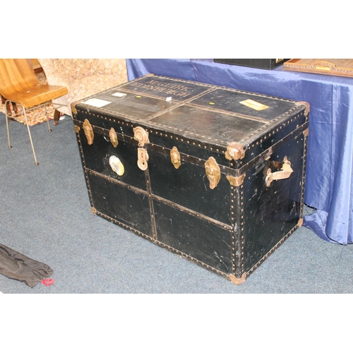 652 - Large early 20thC ebonized wood and metal bound luggage trunk, labelled McGuirk Edinburgh, H66cm.