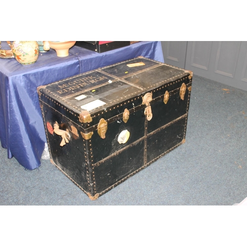 652 - Large early 20thC ebonized wood and metal bound luggage trunk, labelled McGuirk Edinburgh, H66cm.