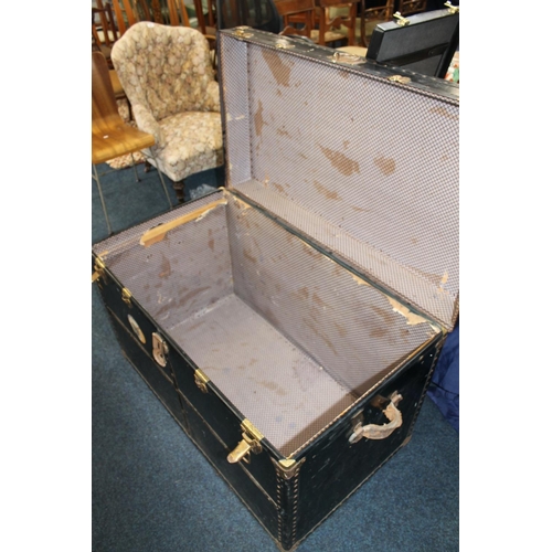 652 - Large early 20thC ebonized wood and metal bound luggage trunk, labelled McGuirk Edinburgh, H66cm.