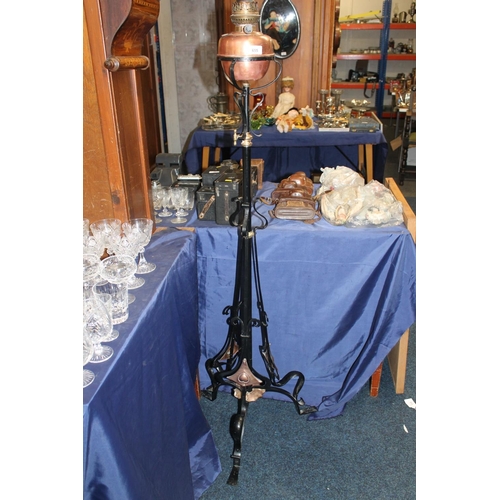 655 - Art Nouveau wrought iron and copper floor standing oil lamp, H148cm.