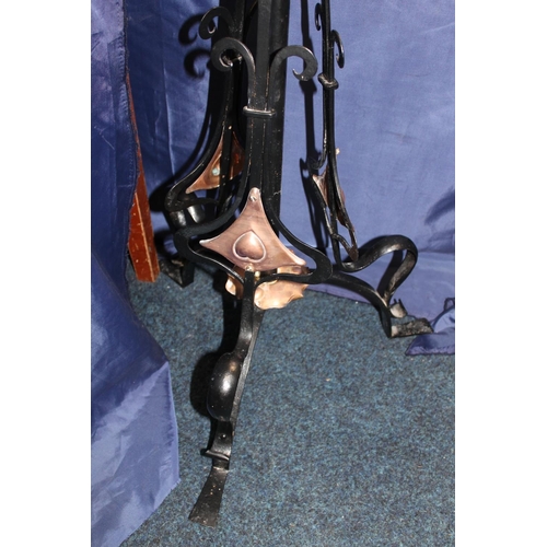 655 - Art Nouveau wrought iron and copper floor standing oil lamp, H148cm.