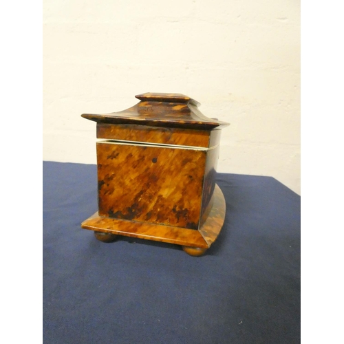 320 - Tortoiseshell and ivory inlaid tea caddy, circa early 19th century, of pagoda shape, the hinged top ... 