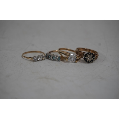 420 - Four 9ct gold gem set rings, gross 10.0g.