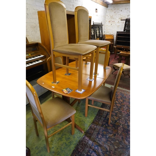 590 - G Plan style pull out dining table and six matching chairs.