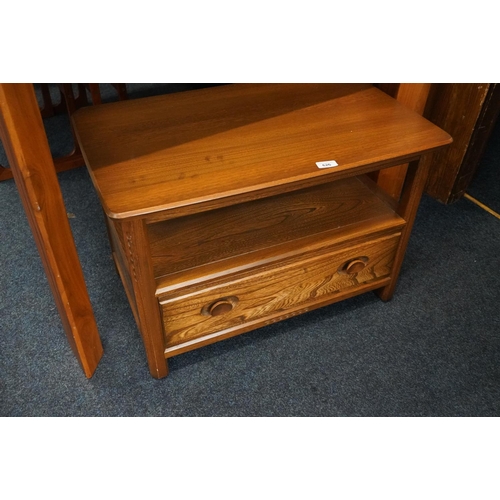 626 - Ercol TV stand with base drawer containing DVDs.