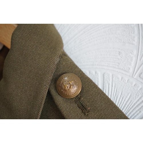 1736 - British army uniform, a khaki green jacket with brass Kings Own Scottish Borderers KOSB button, epau... 