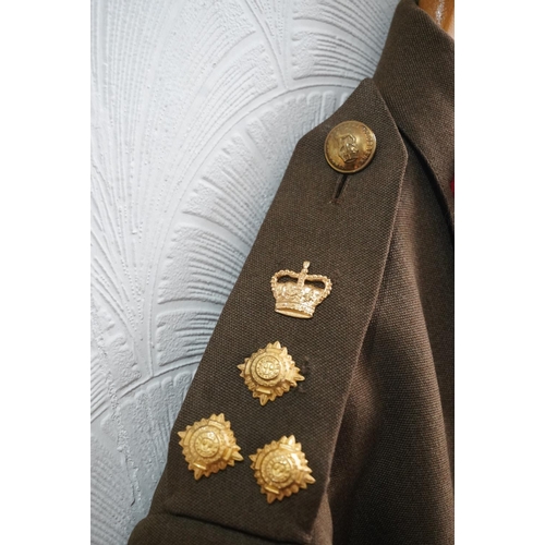 1740 - British army uniform, a khaki green jacket having medal ribbons for MBE, general service medal with ... 