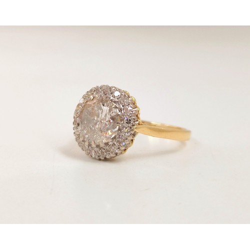 93 - 18ct gold diamond cluster ring, the centre brilliant cut stone measuring 1.6cts, encircled by smalle... 