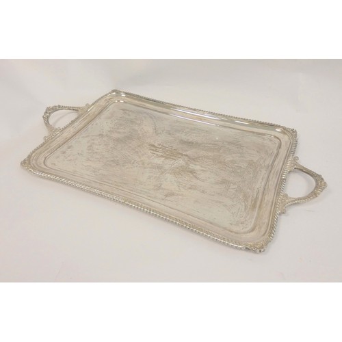 102 - Silver tray, rectangular with slightly incurved sides and gadroon and scroll edges by Hamilton &... 