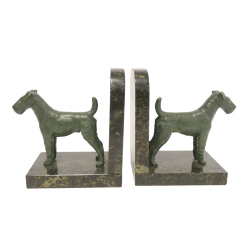 242 - Pair of cold painted terrier bookends on a mottled marble effect base. 15cm high.