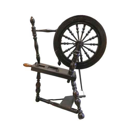 360 - Antique stained oak Scottish spinning wheel, with balustrade columns to the wheel, on turned column ... 