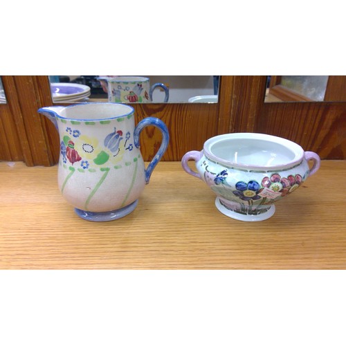 213 - Three Macmerry Scottish Art pottery plates and a sugar bowl, and a china jug.