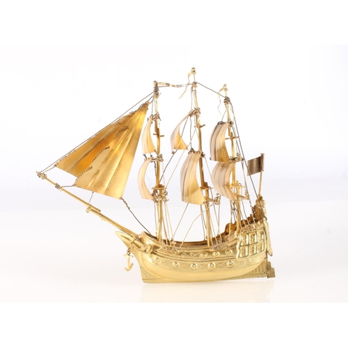 26 - Nef table decoration in the manner of a Spanish? galleon or 'Man O' War', the ship modelled with thr... 