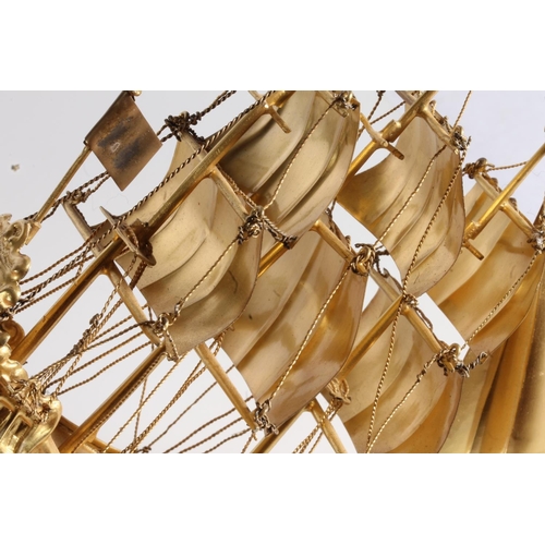 26 - Nef table decoration in the manner of a Spanish? galleon or 'Man O' War', the ship modelled with thr... 