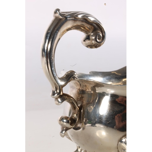 51 - 18th century or possibly earlier, silver sauce boat of typical form with serpentine edge, scroll han... 