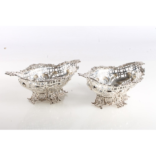 57 - Pair of pierced silver bon bon dishes of boat shape by William Comyns & Sons, London 1889, 291g ... 