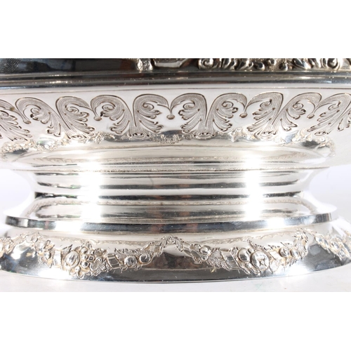 62 - Victorian silver twin handled punch bowl with gilded interior and embossed ornate designs of garland... 