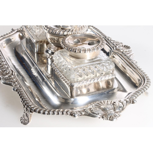 65 - Late Georgian silver desk stand with chamber stick and snuffer and inkwells by S C Younge & Co, ... 